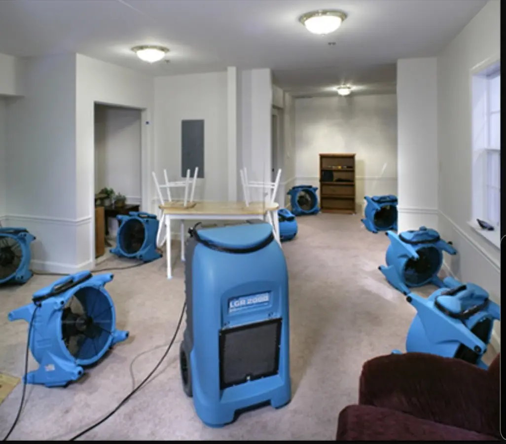 Air movers and dehumidifier setup for Water Damage Restoration in Whitewater